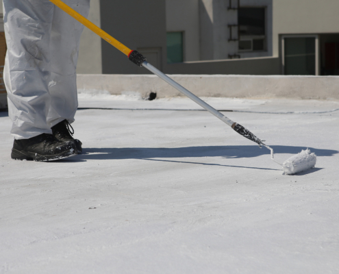 Roof Coating Installation, worker in boots