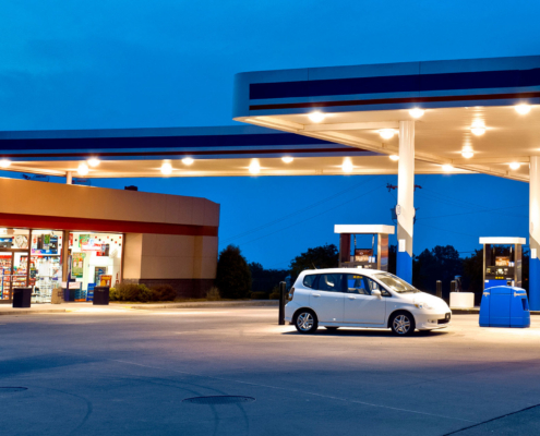 Side view of a convenience store at night